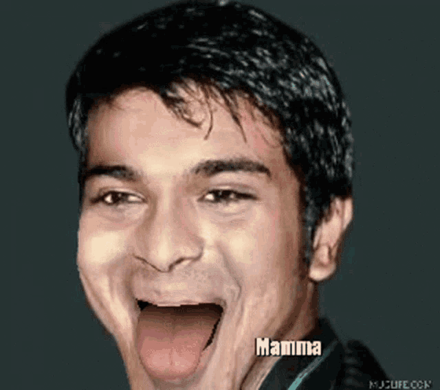 a man is making a funny face with mamma written on his face