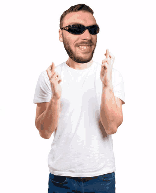 a man wearing sunglasses and a white shirt is making a wish
