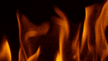 a yellow pipe is against a fire background
