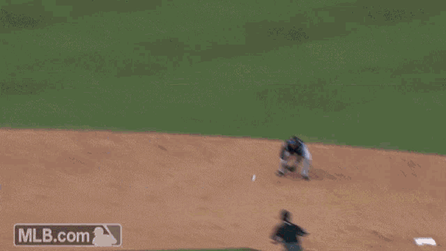 a blurry picture of a baseball game with mlb.com written on the bottom