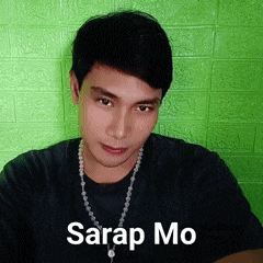 a man wearing a black shirt and a necklace with the words sarap mo written on it