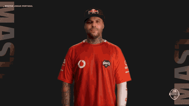 a man wearing a red shirt that says master on it
