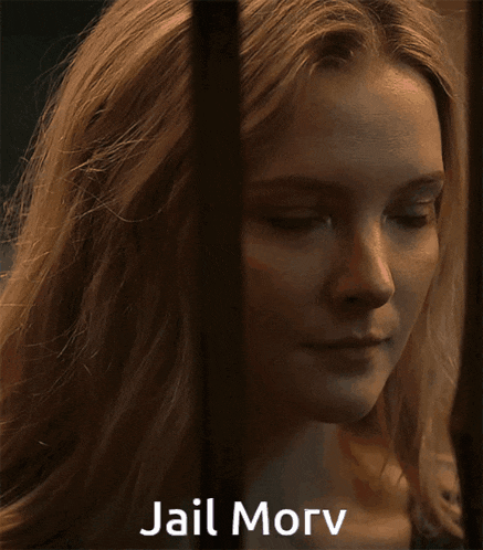 a close up of a woman behind bars with jail morv written on the bottom