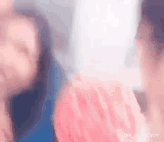 a blurry picture of two women 's faces with the words " dei_in_motion " on the bottom