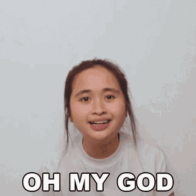 a young girl is making a funny face with the words oh my god above her