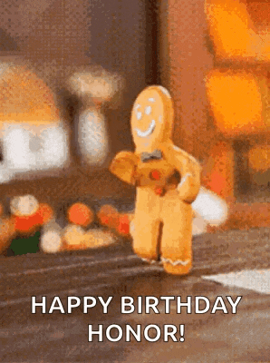 a gingerbread man is holding a teddy bear and smiling .