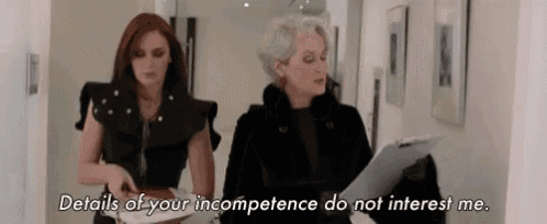 two women are standing next to each other in a hallway and one of them says details of your incompetence do not interest me .