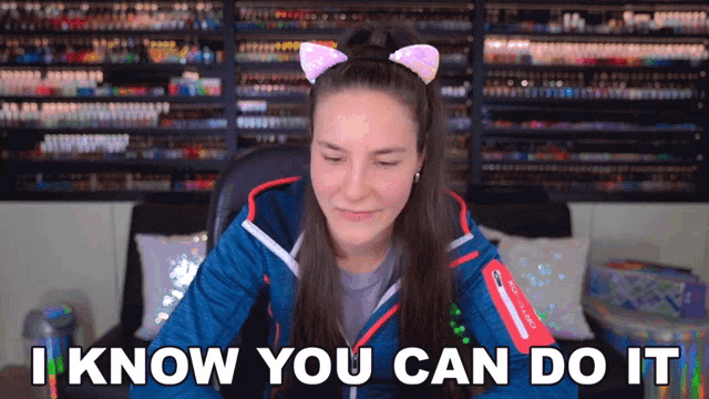 a woman with a cat ear headband says i know you can do it