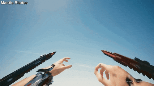 a person holding a mantis blades in their hand
