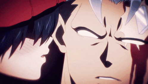 a close up of a man 's face with a woman 's face in the background