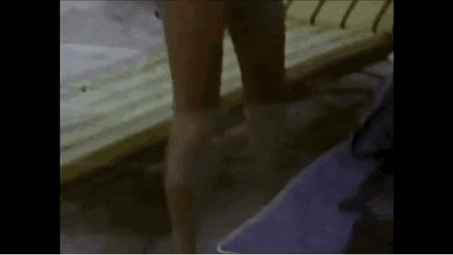 a woman 's legs are visible in a blurry photo .