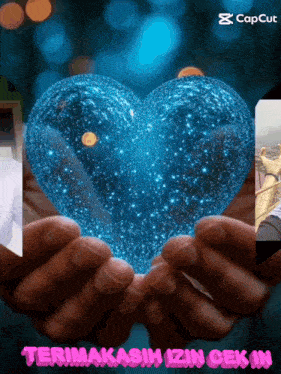 a person is holding a blue heart in their hands with the caption terima kasih izin cek in