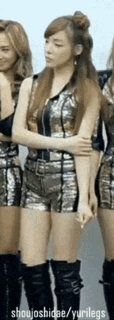 a group of girls are standing next to each other with shoujoshidae / yurilegs written in the corner