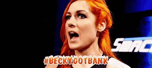 a woman with red hair is making a funny face while standing in front of a blue background .