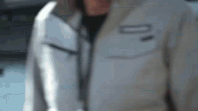 a blurry picture of a person wearing a jacket that has the number 10 on it