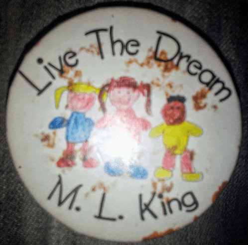 a button that says live the dream m.l. king on it
