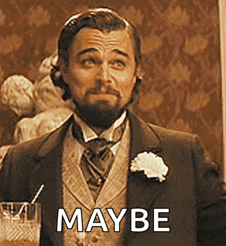 a man in a suit and tie is holding a glass of whiskey and says maybe