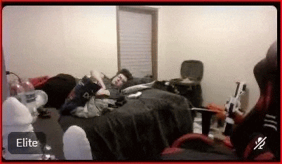 a man is laying on a bed in a messy room with a red border .