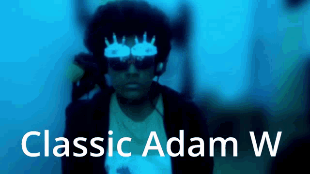 a man wearing sunglasses and headphones with the words classic adam w below him