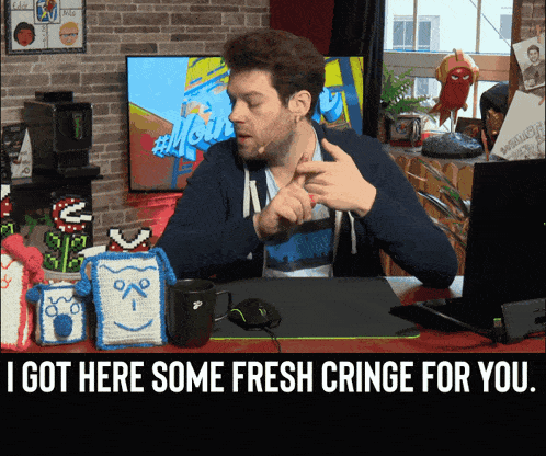 a man sitting at a desk with the words " i got here some fresh cringe for you " on the bottom