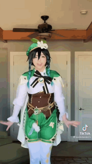 a woman in a costume is standing in front of a ceiling fan .