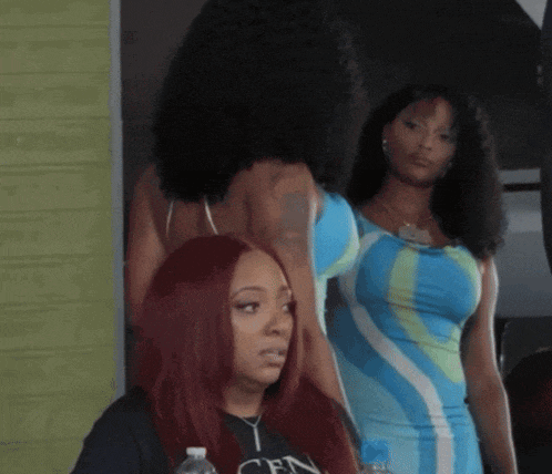 a woman with red hair is wearing a shirt that says cen on it