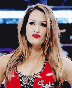 a woman wearing a red tank top that says fearless