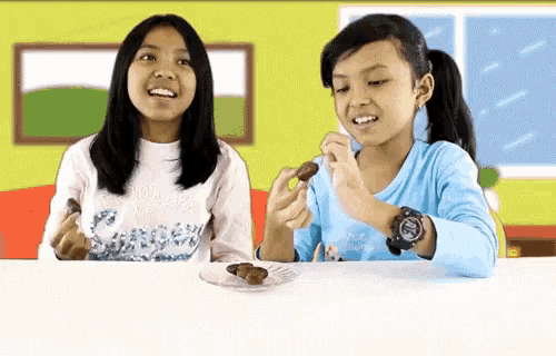 a girl wearing a g-shock watch looks at a plate of food