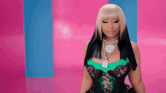 a woman wearing a green corset and a necklace with a dollar sign on it