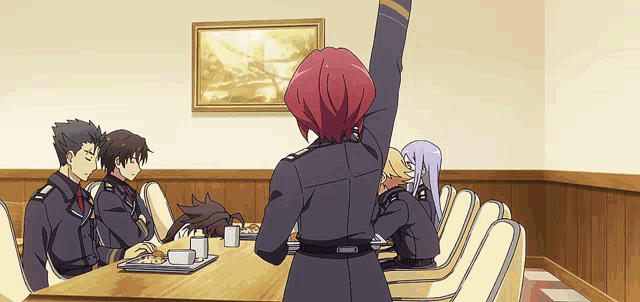 a group of people are sitting around a table with a woman raising her arm