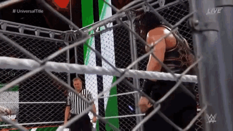 Roman Reigns Brock Lesnar GIF - Roman Reigns Brock Lesnar Chair GIFs