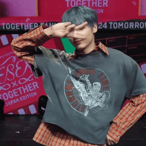 a man wearing a shirt that says together japan edition