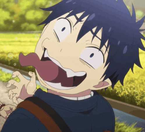 a close up of a person making a funny face with their tongue sticking out