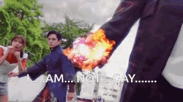 a man holding a fireball with the words " i am not gay " below him