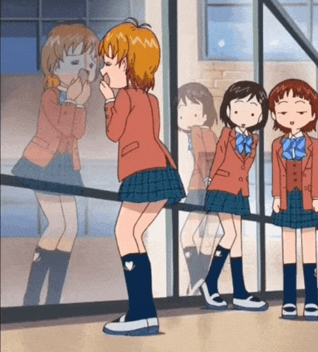 a girl in a school uniform stands in front of a glass door