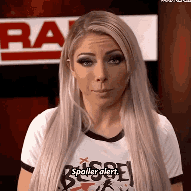 a woman wearing a white shirt that says spoiler alert on it