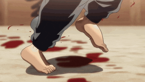a person 's bare feet are shown walking on a bloody floor