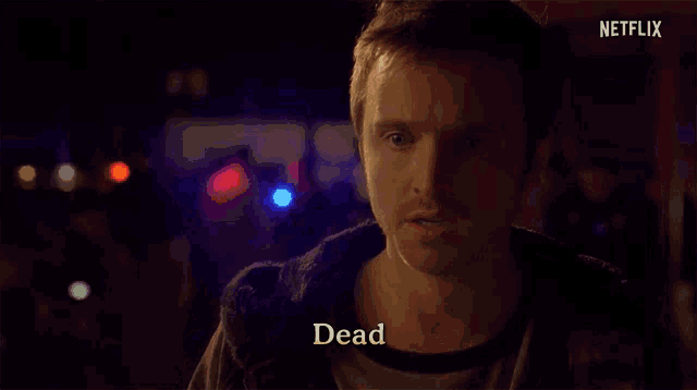 a close up of a man 's face with the word dead written on the bottom .