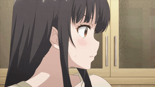 a close up of a girl 's face with her mouth open