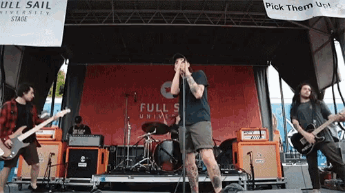 a full sail university stage with a band playing on it