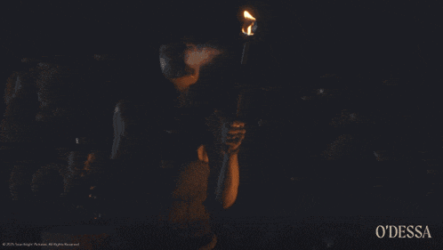 a woman holding a torch with the word odessa on the bottom left