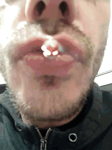 a close up of a man 's mouth and nose