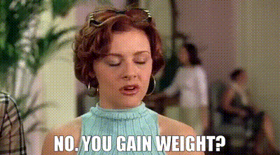 a woman is standing in a room with her eyes closed and says `` no , you gain weight '' .