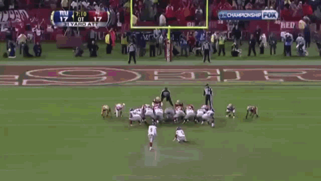 a football game is being played on fox