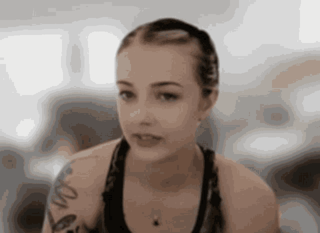 a woman with a tattoo on her arm that says ' i love you '