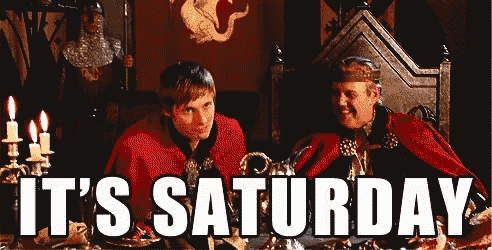 two men sitting at a table with the words it 's saturday