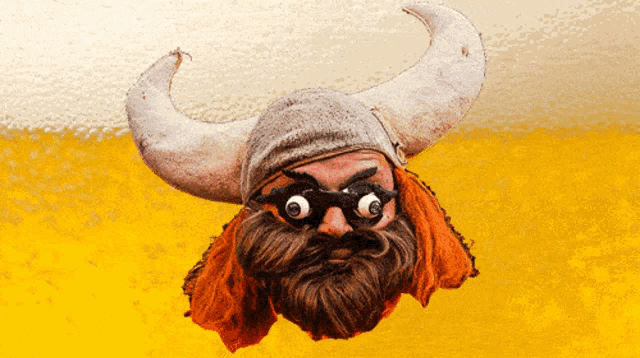 a cartoon of a man with a beard wearing a horned helmet