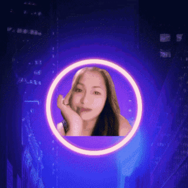 a woman 's face is surrounded by a purple circle