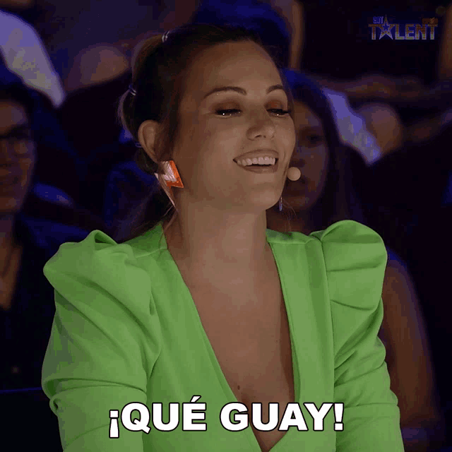 a woman in a green top says que guay in spanish