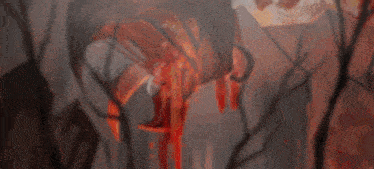 a blurry image of a person with blood on their clothes